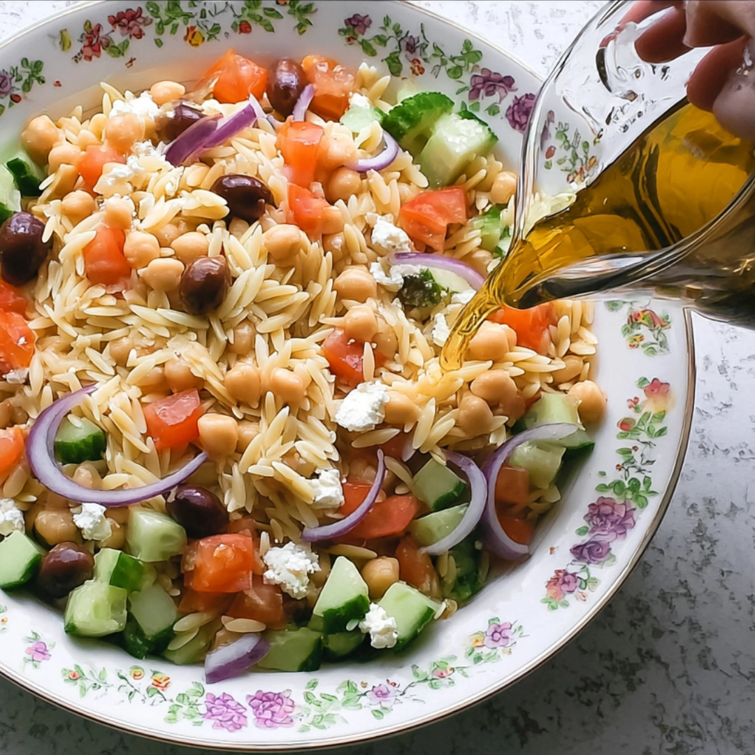 cooked-orzo-cooling Cooked orzo pasta cooling with olive oil