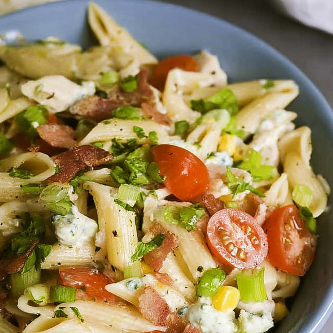 cobb-pasta-salad-recipe-2.webp Creamy Cobb pasta salad recipe mixed with fresh vegetables and herbs