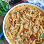 Creamy marry me shrimp pasta in a skillet with basil garnish, ready to serve for a romantic dinner.